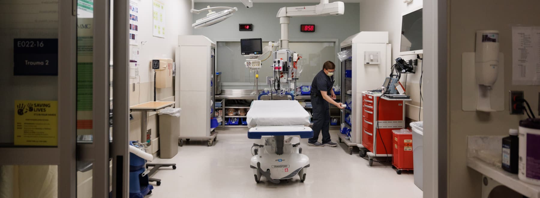 A nurse checks supplies in the trauma room of the ED at University Hospital.